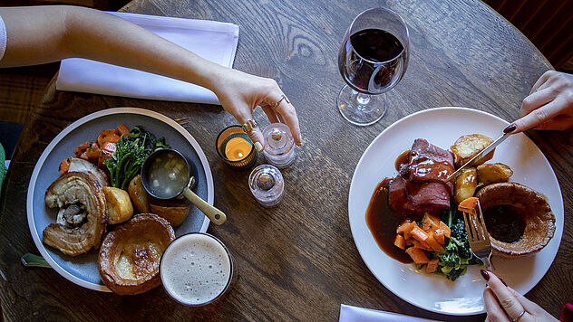 Roast beef and roast pork with potatoes and vegetables